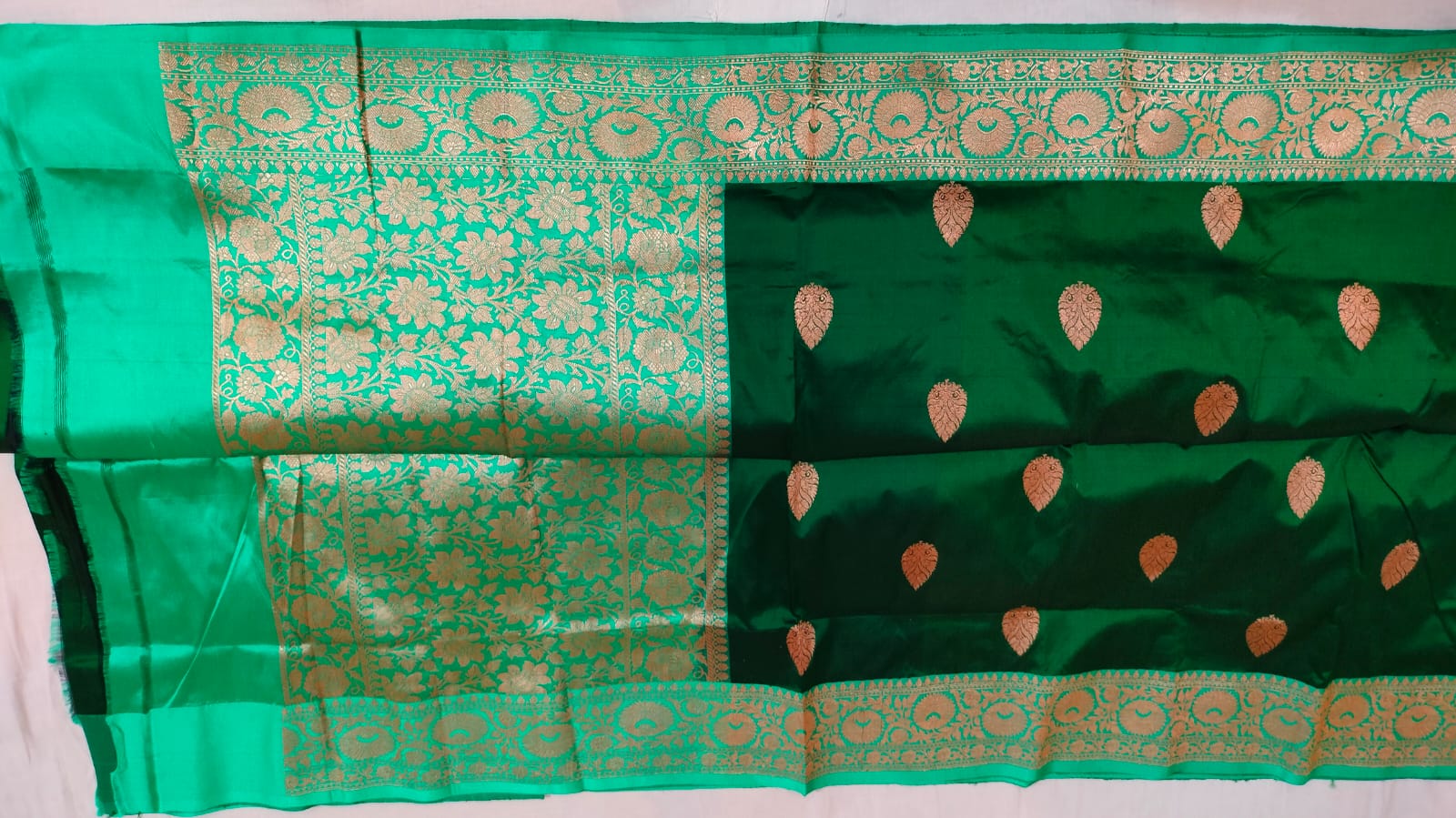 Beautiful tussar Banaras Kaduva butta saree in bottle green and light green