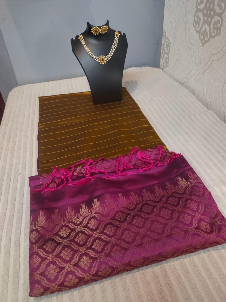 kanjivaram softsilk saree in dark olive green with pink color with golden stripes 