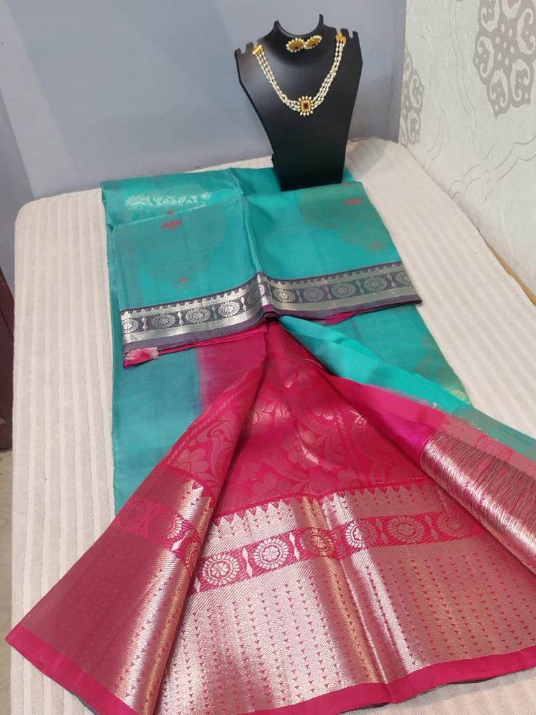 Kanjivaram silk saree in sea green with pink double warp with silver jari