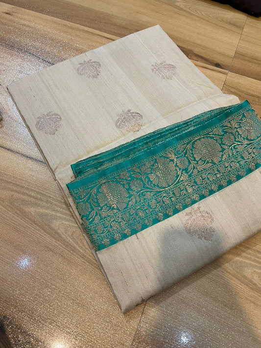 Tussar Banaras Kaduva butta  saree in cream with apple green with meenakari