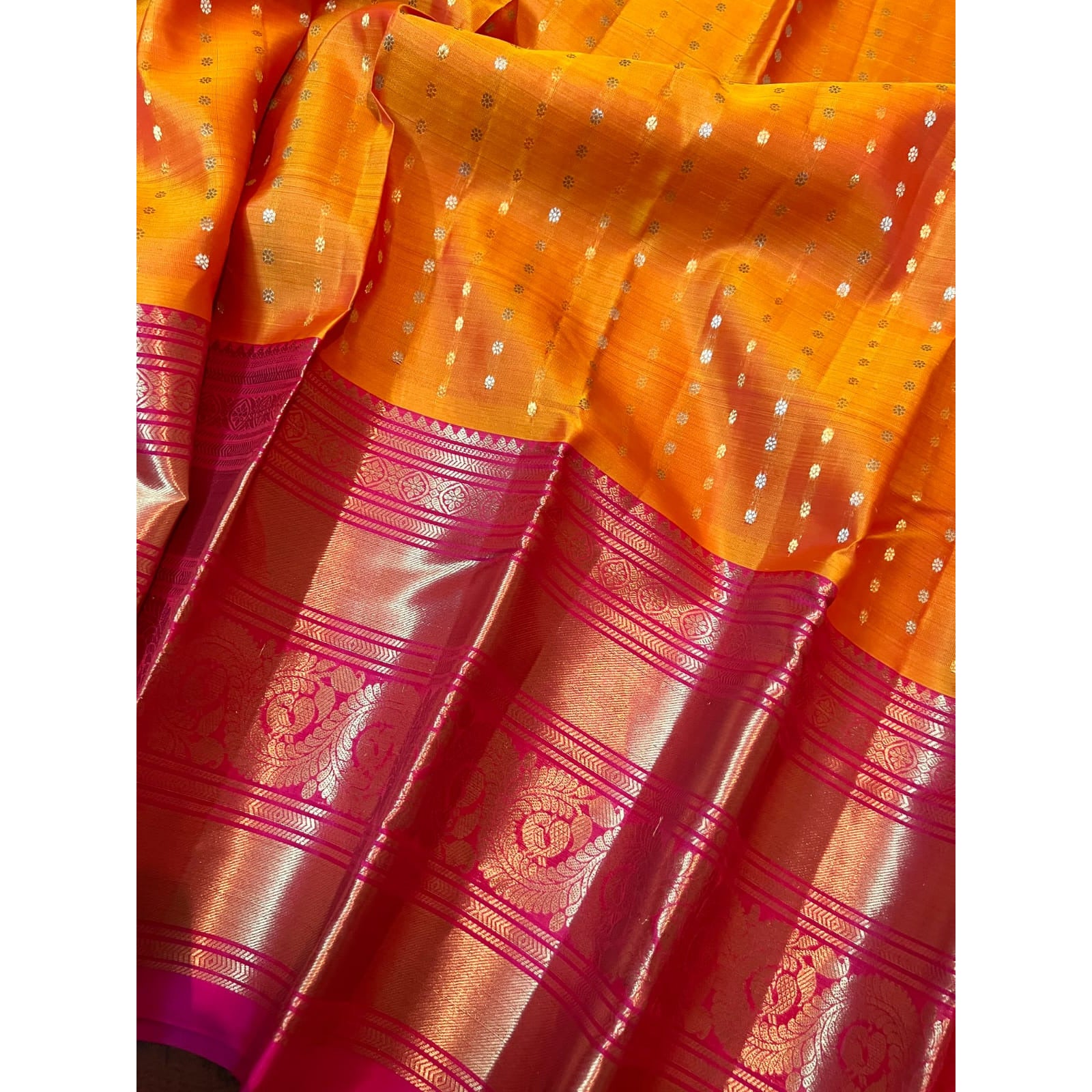 Pure Kanjeevaram border gadwal silk saree in Mango yellow body with golden butta & red color long border