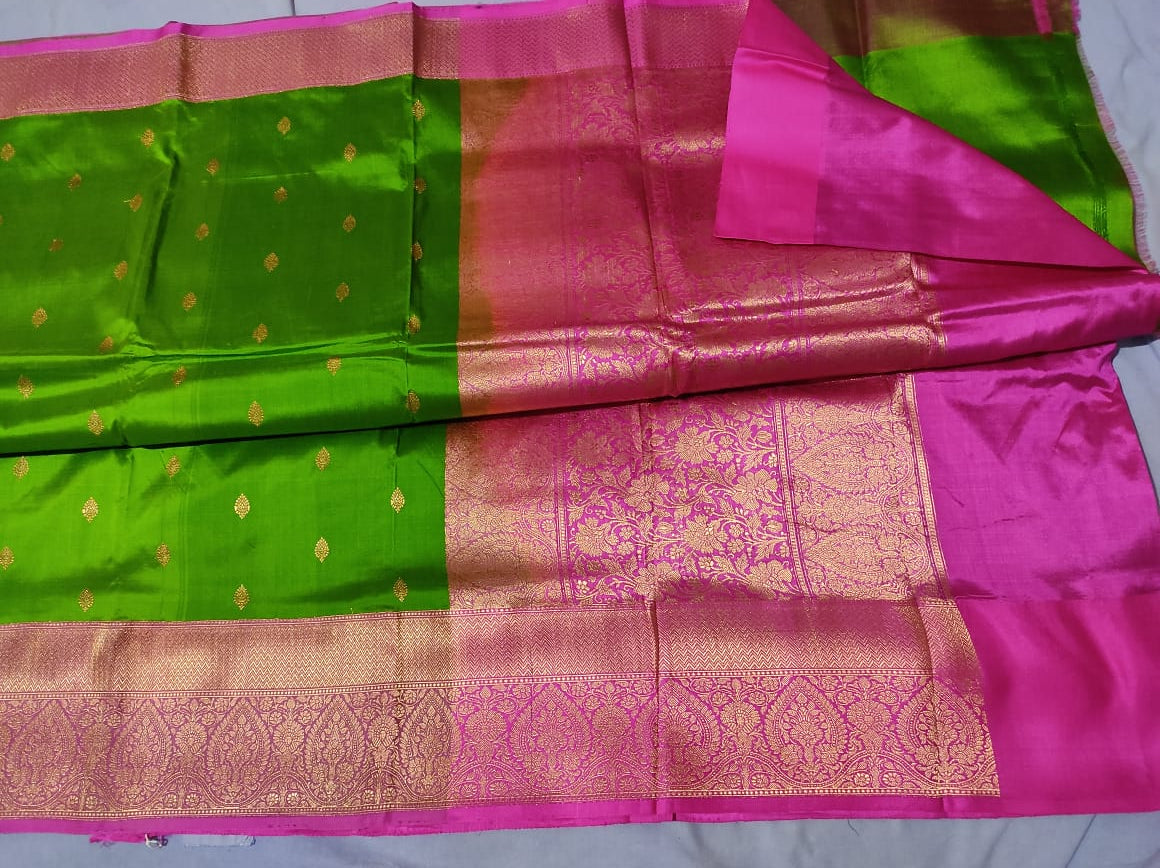 Pure Katan Banarasi in parrot green body with pink Color Saree