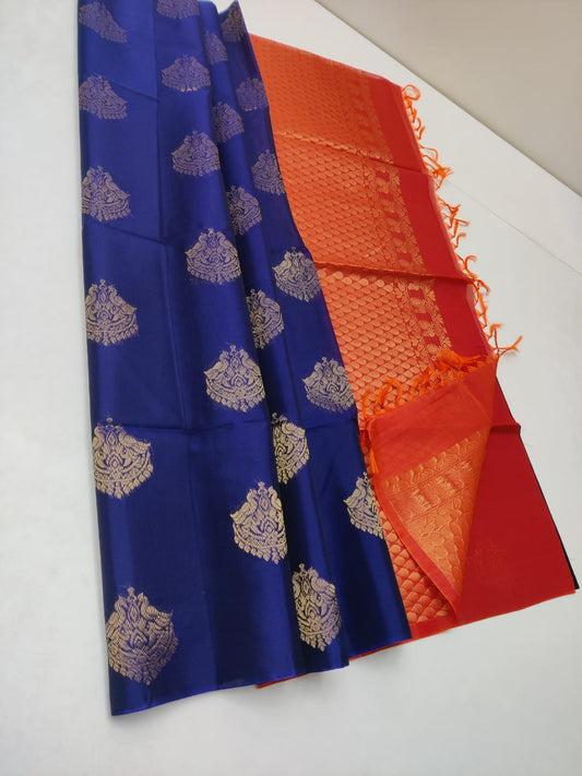 Cotton silk pure borderless in royal blue with red body color with golden butti