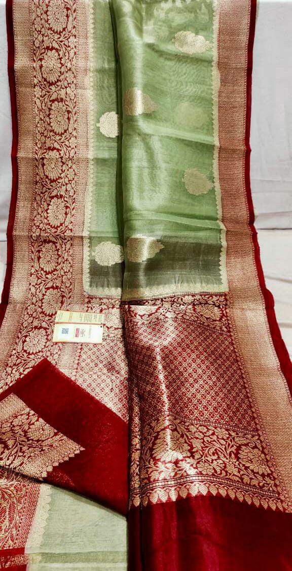 Kora Banarasi saree in kaduva butta handwoven in olive green with red