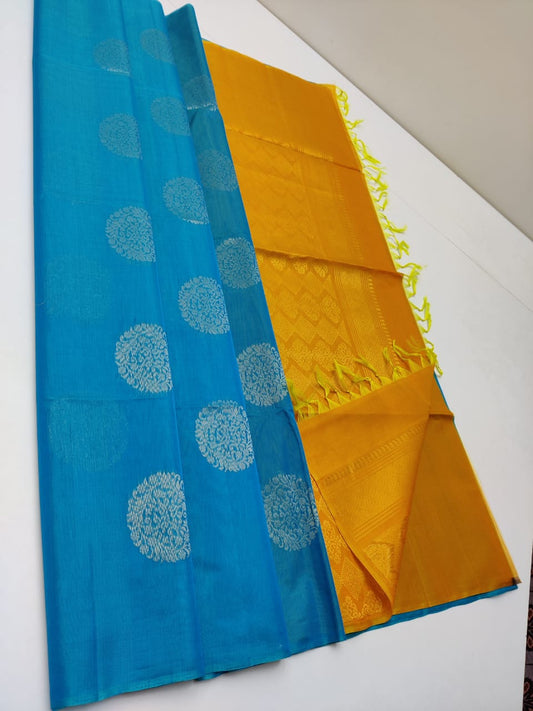 Cotton silk pure borderless in blue color with golden butti and Golden yellow mundi