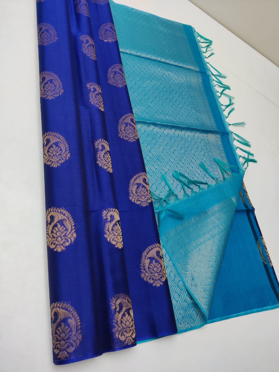 Cotton silk pure borderless in blue color with golden butti