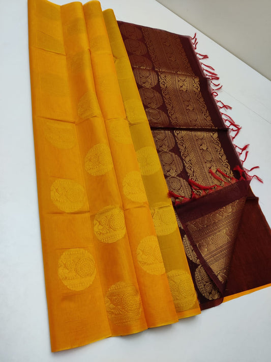 Cotton silk pure borderless in mustard yellow color with golden butti