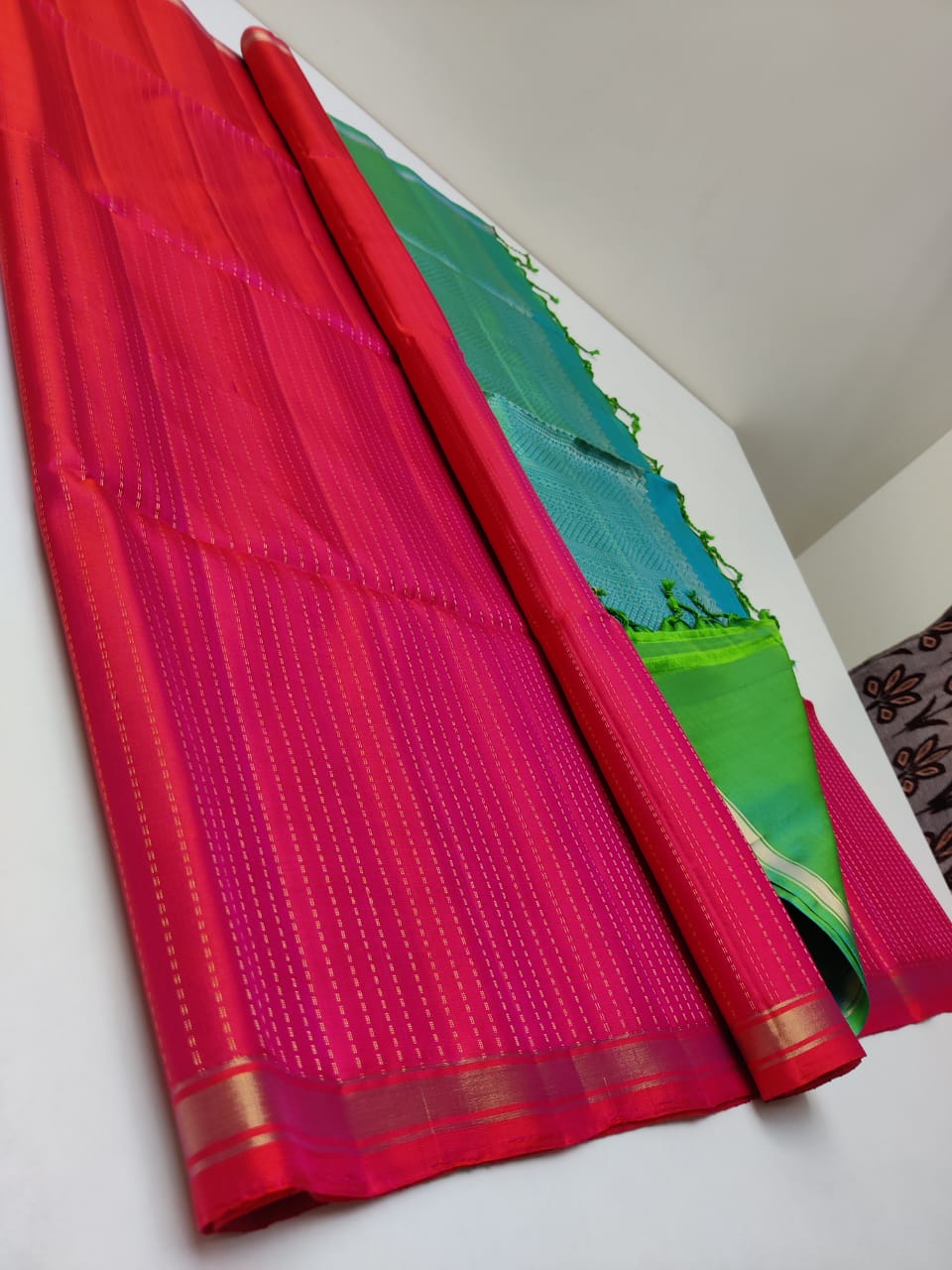 kanjivaram silk saree with double warp in borderless red with green border weaving