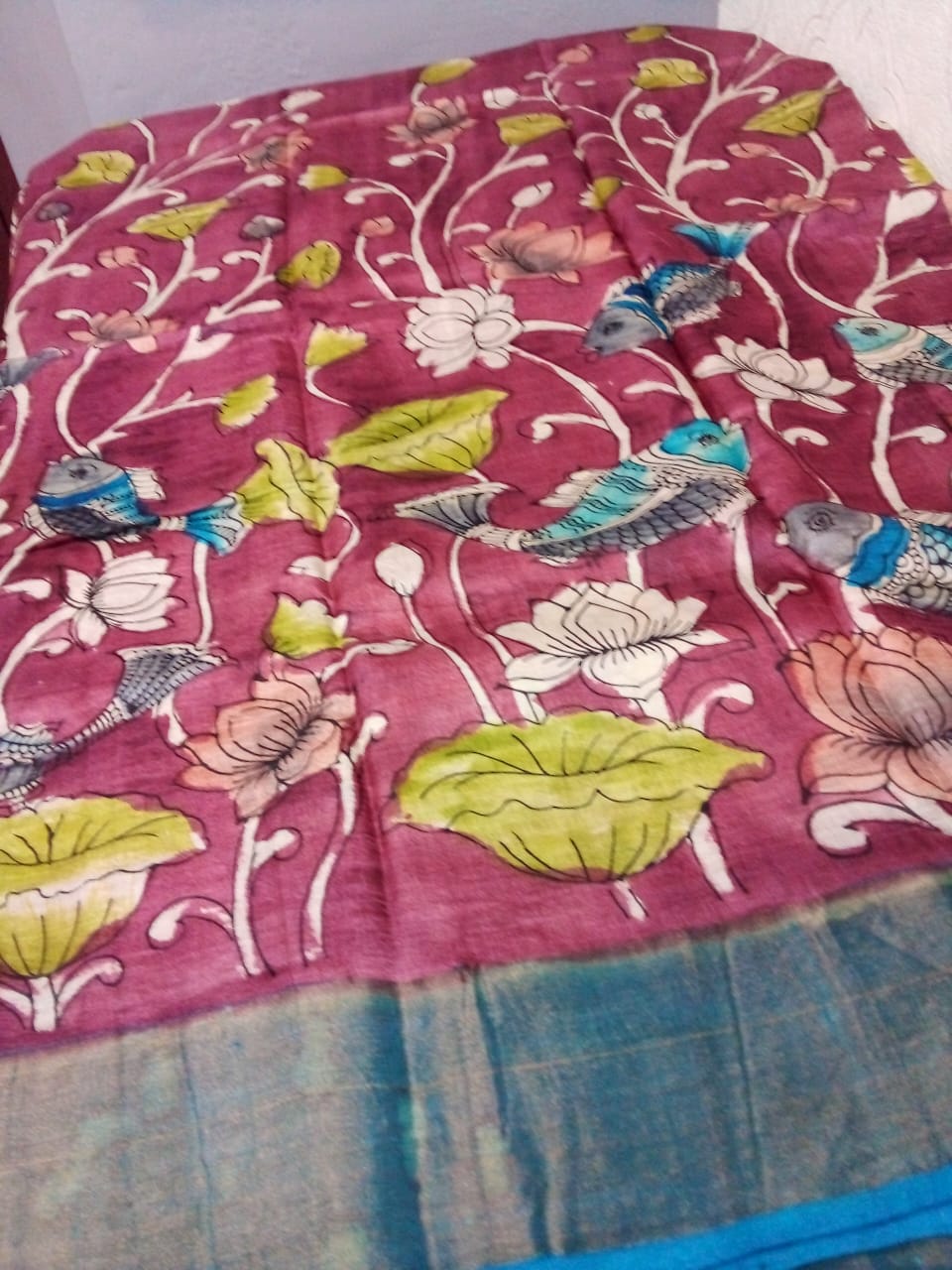 Hand painted Pen Kalamkari in Pure Zari Tussar Saree maroon with Pink border with lotus flowers with fish story full body