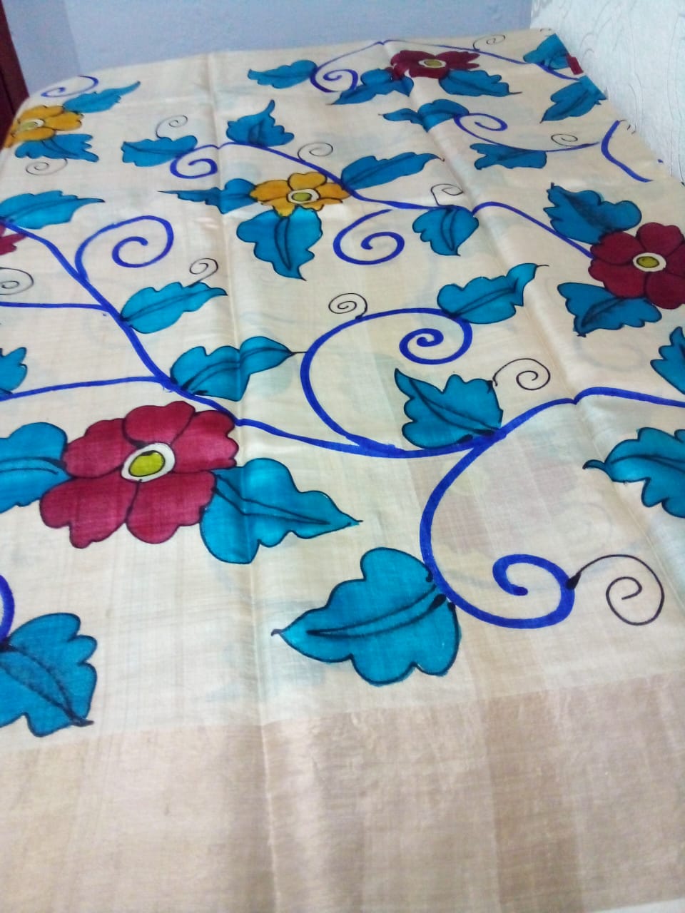 Kalamkari hand-painted in Pure Zari Tussar Saree milky white with Pink border with flowers and leaves story