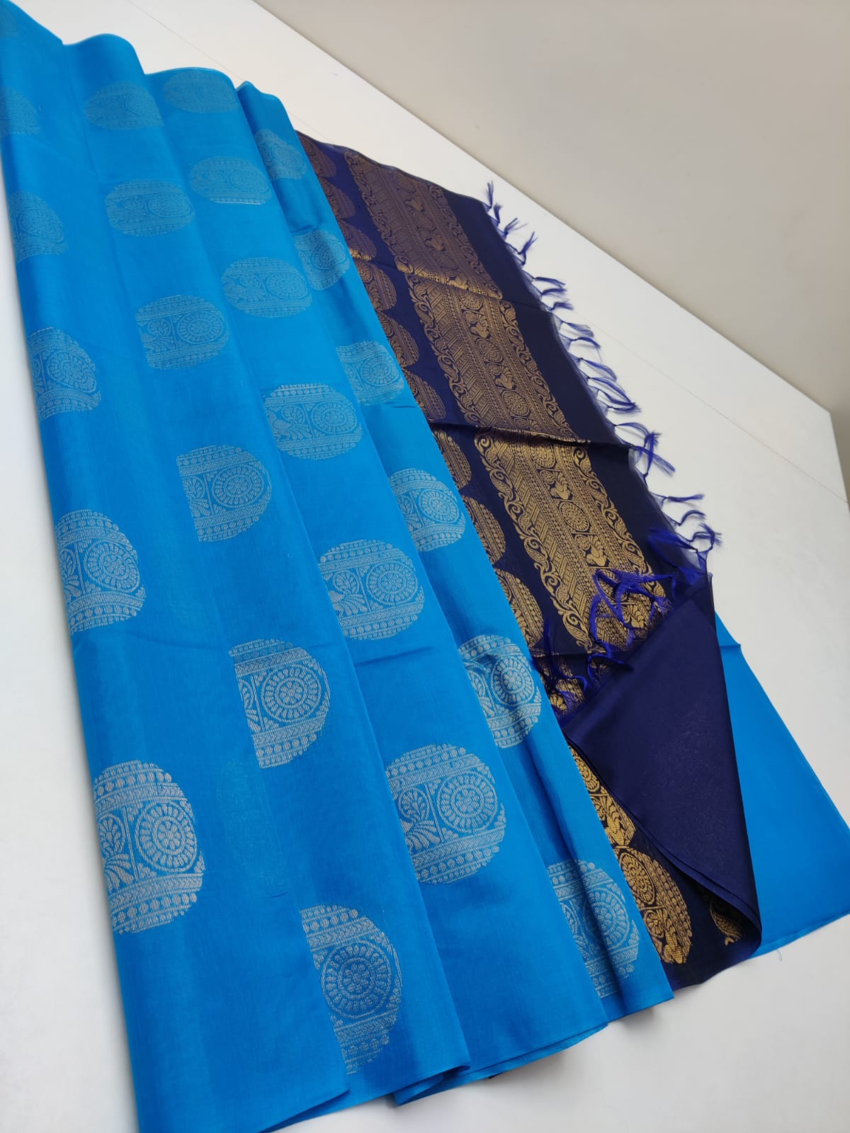 Cotton silk pure borderless in blue color with round butti and navy blue mundi