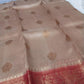 Kora Banarasi saree in kaduva butta handoven in biscuit with red