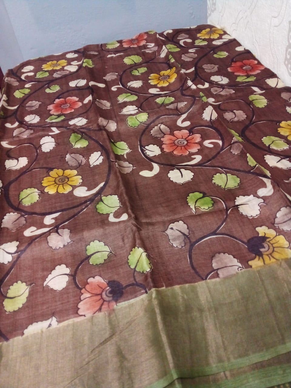 Pen Kalamkari in Pure Zari Tussar Saree Brown with Green border with flowers story body