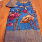 Hand painted Pen Kalamkari in Pure Zari Tussar Saree Blue with Pink border with lotus flowers with cow story