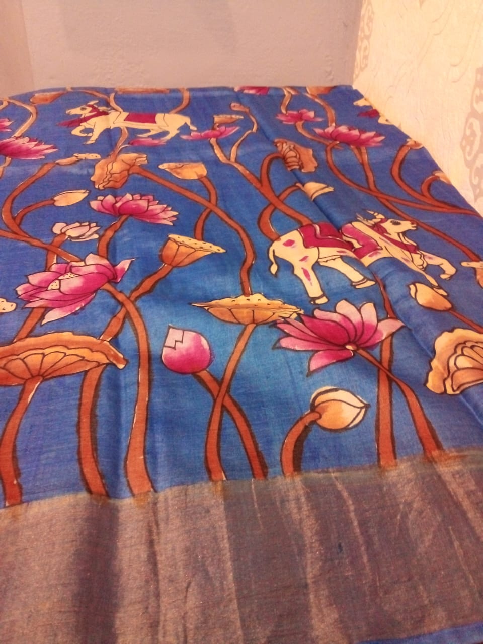 Pen Kalamkari in Pure Zari Tussar Saree Blue with Pink border with lotus flowers with cow story body